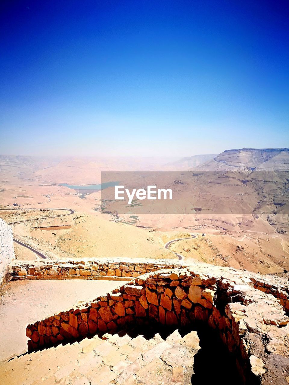 Scenic view of mountain against clear blue sky