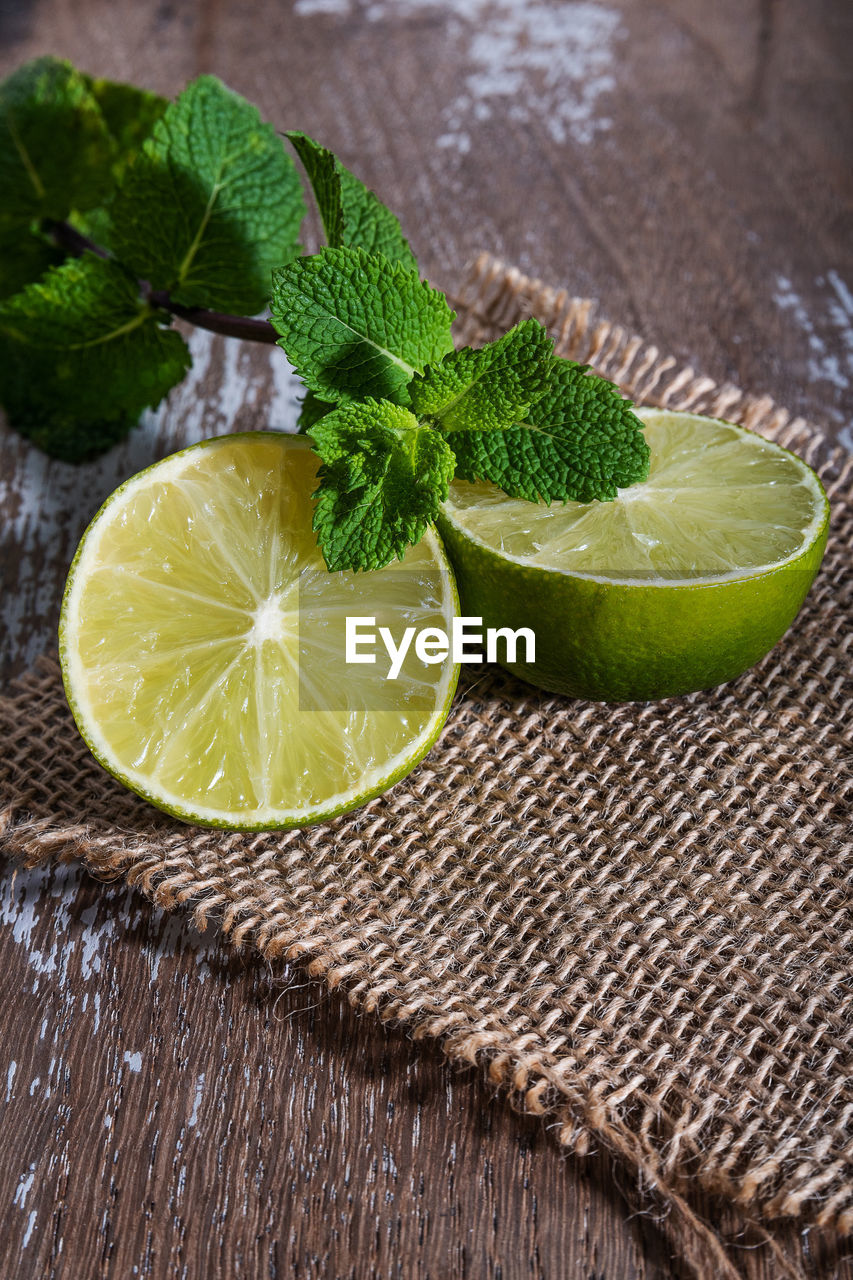 Lime with mint on rustic background