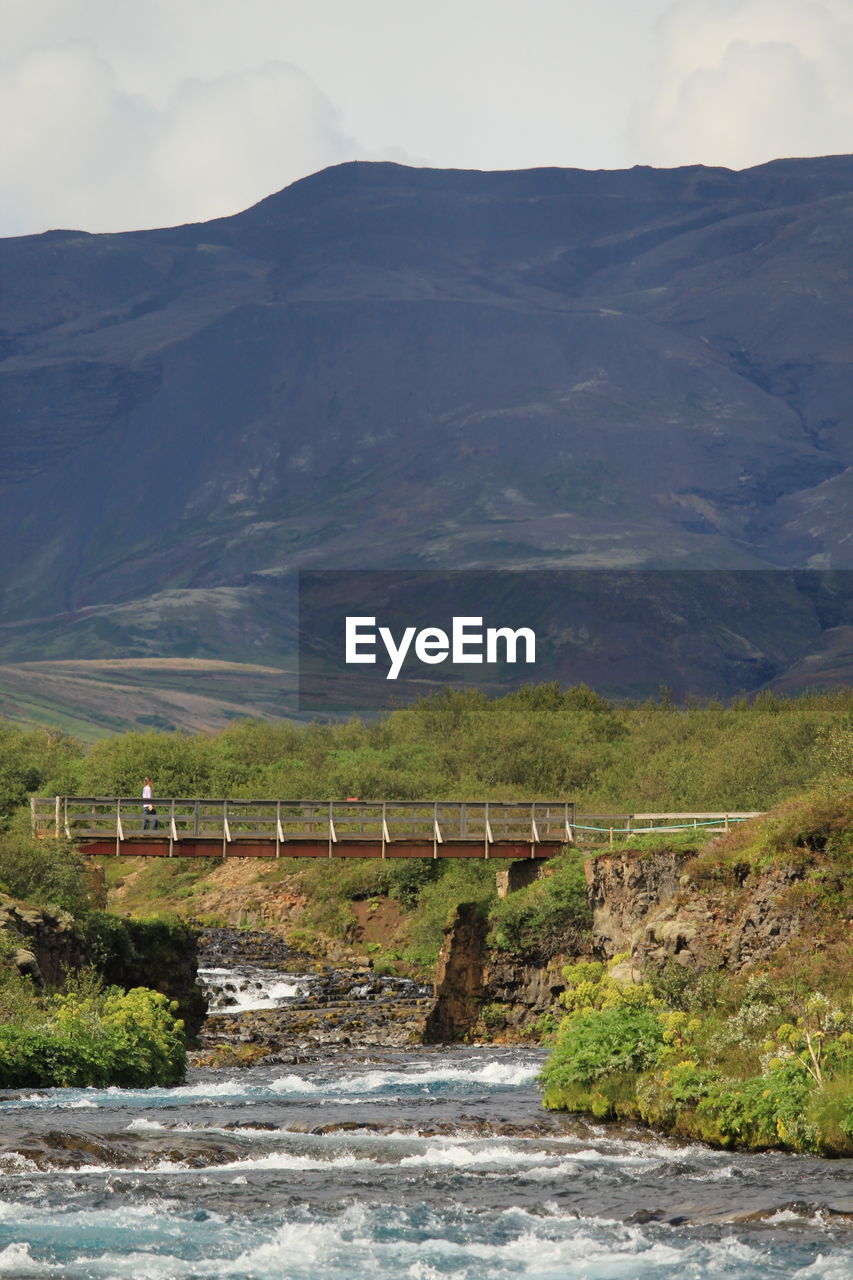 Scenic view of bridge over river against sky