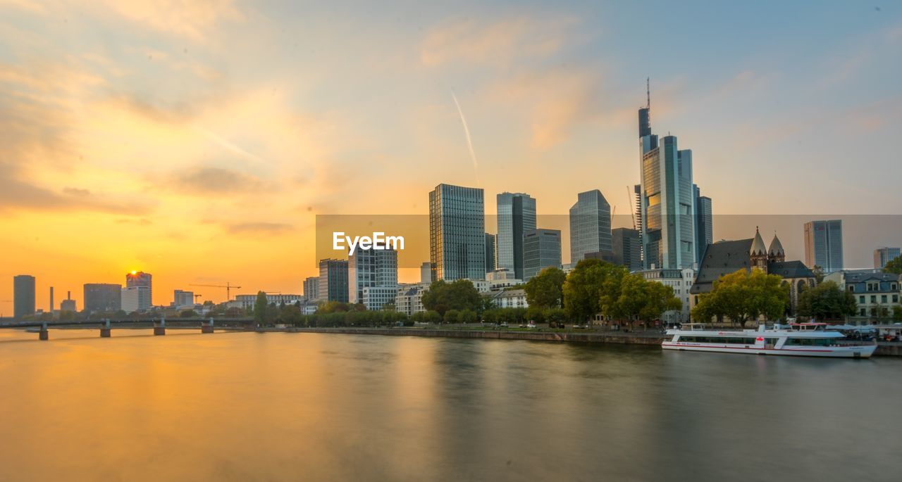 View of buildings in city during sunset