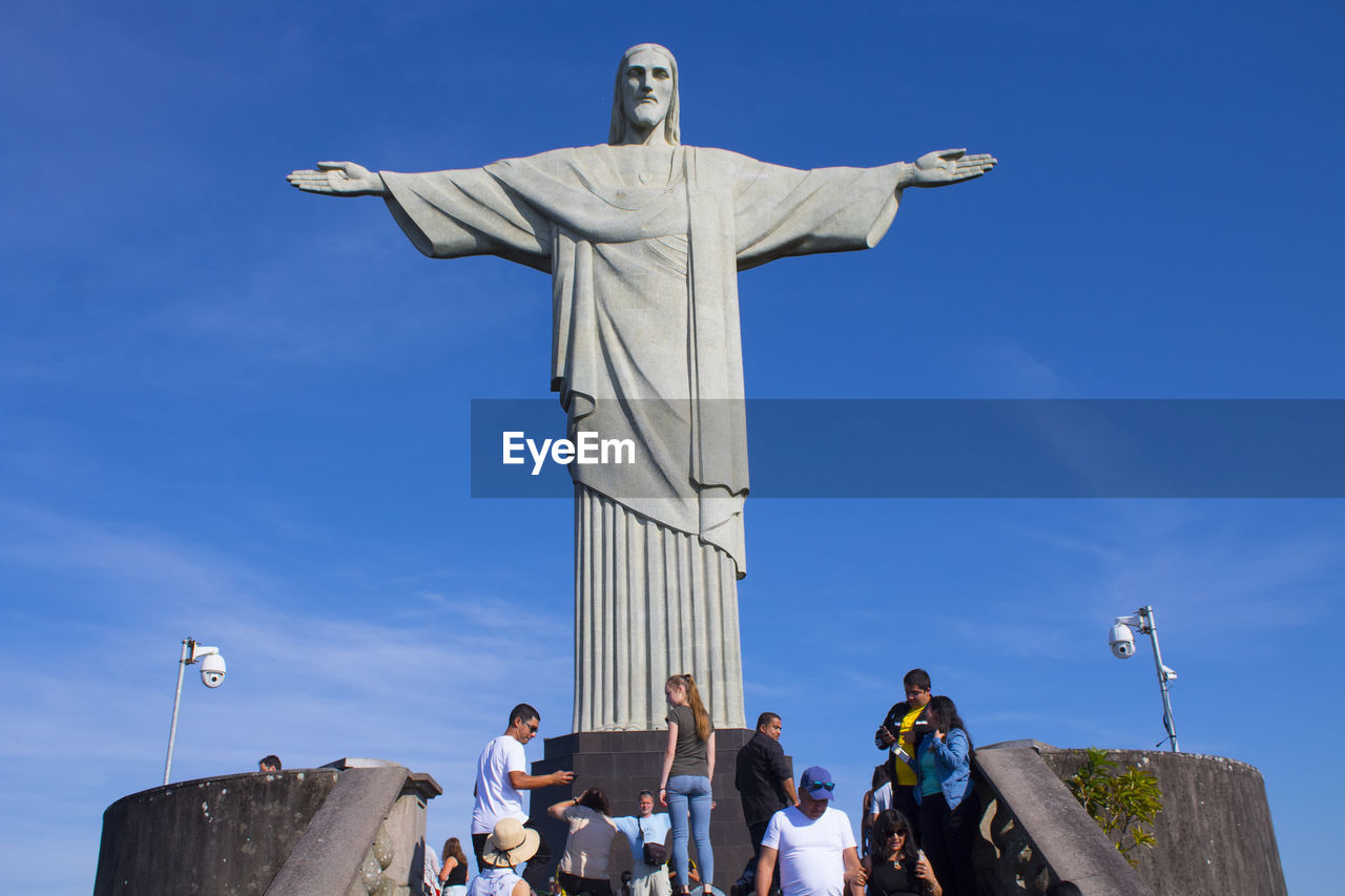 People against statue christ the redeemer