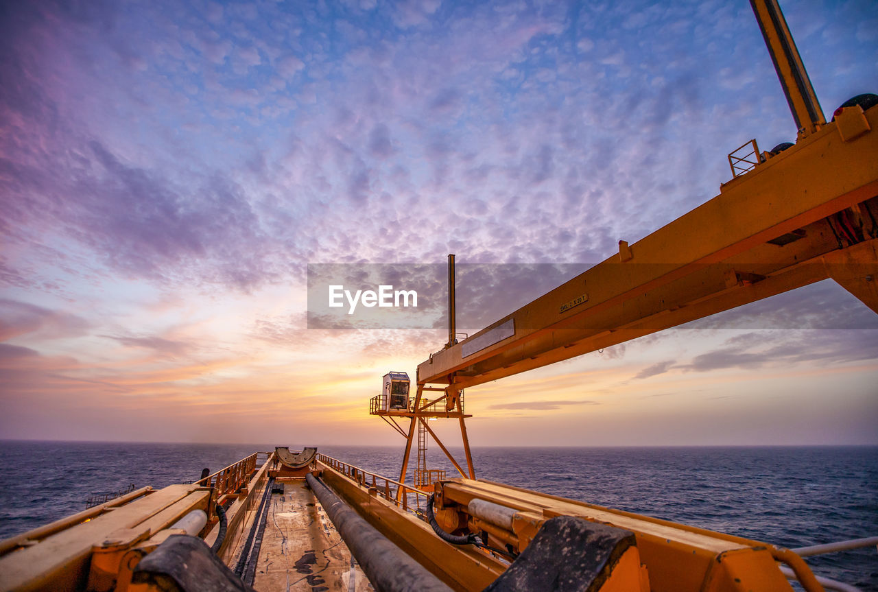 Offshore drilling during sunset in the gulf of mexico