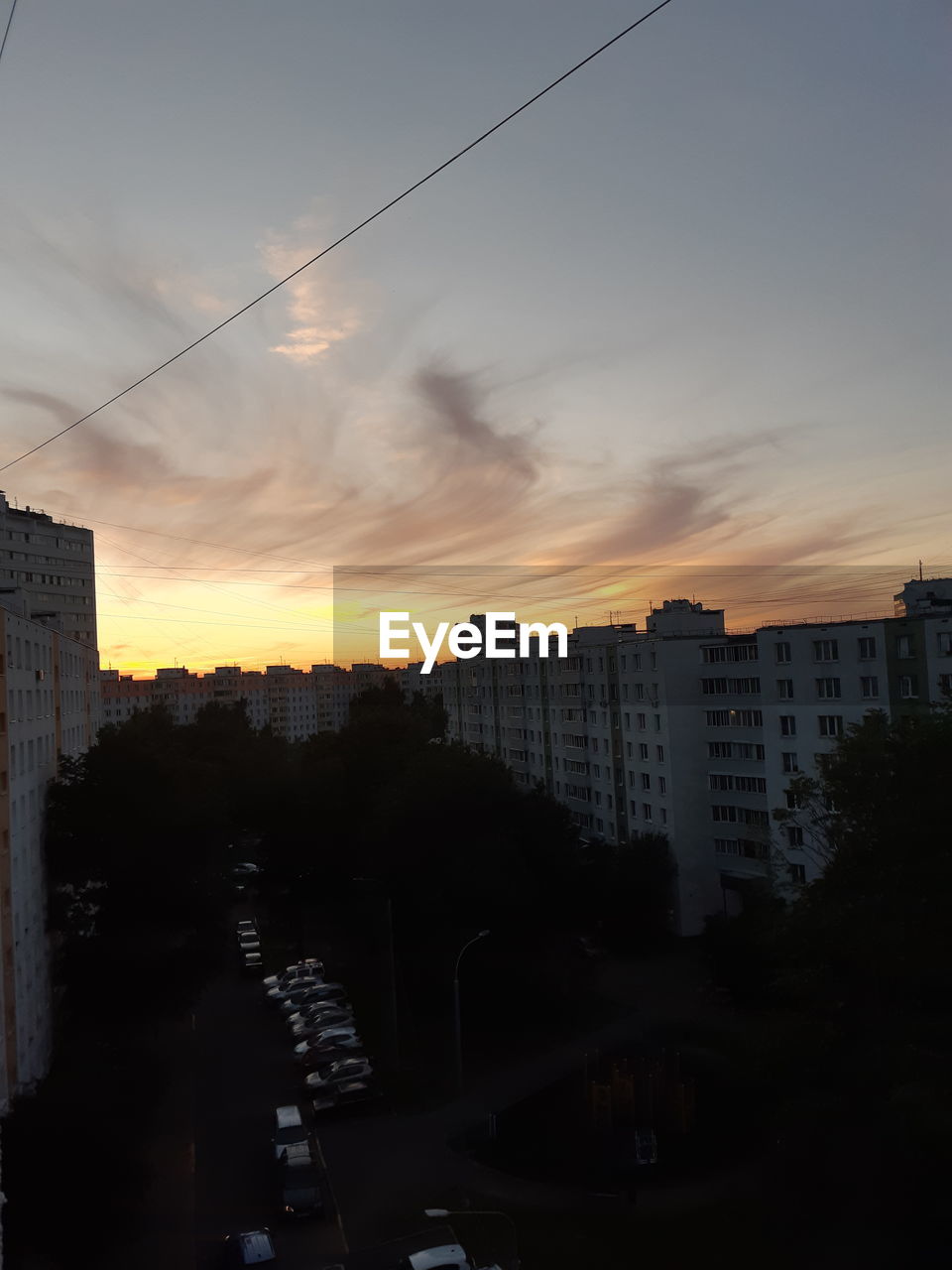 SILHOUETTE BUILDINGS AGAINST SKY DURING SUNSET