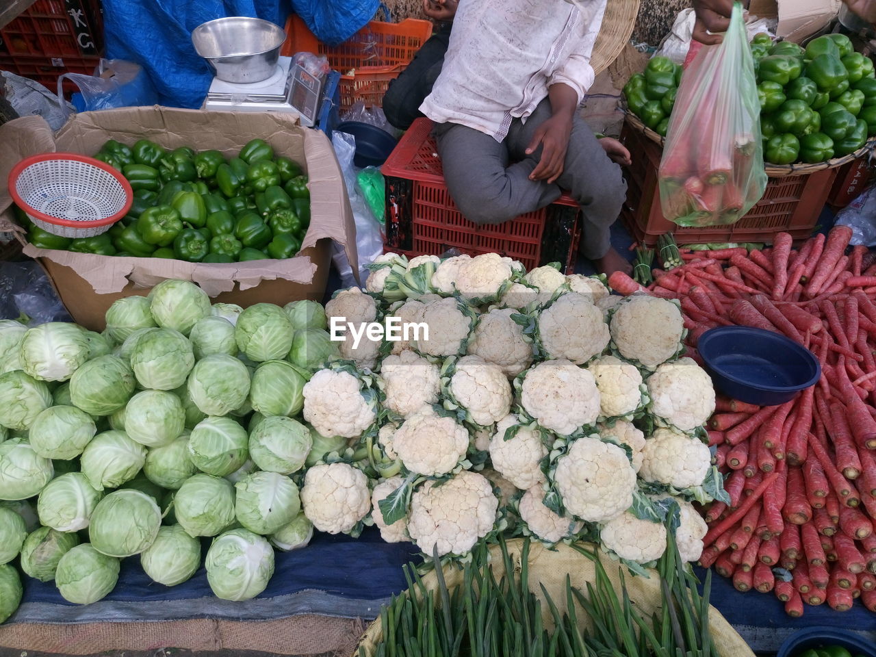High angle view of man selling vegetables at market