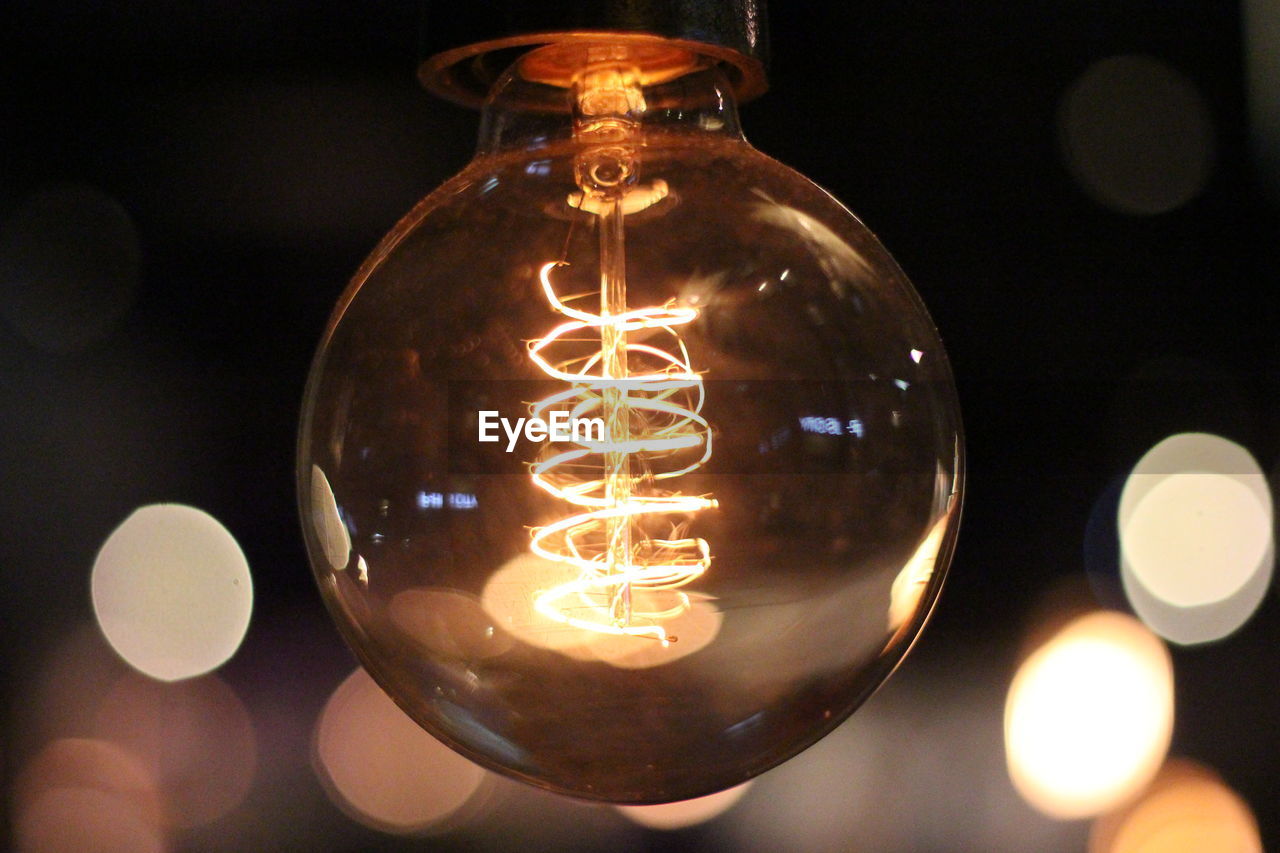 Close-up of illuminated light bulb