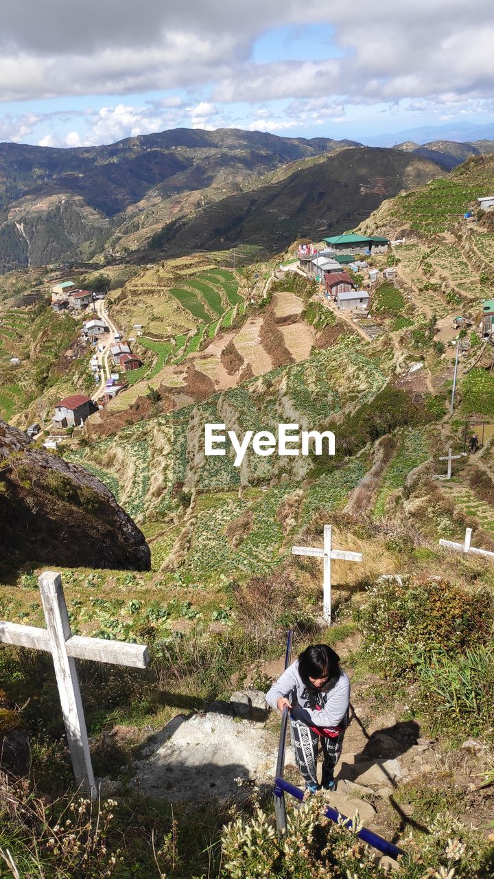 HIGH ANGLE VIEW OF PERSON ON MOUNTAIN RANGE