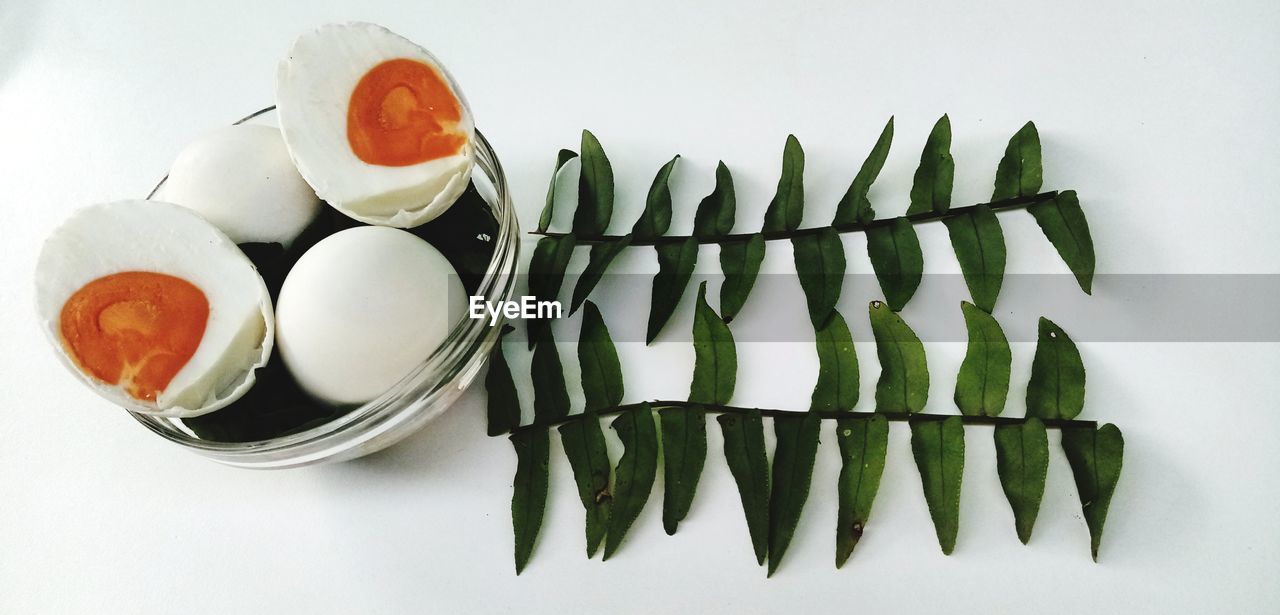 High angle view of breakfast on table against white background