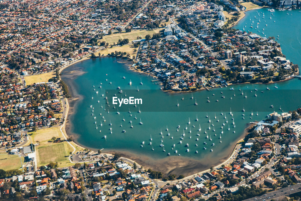 Aerial view of buildings by sea