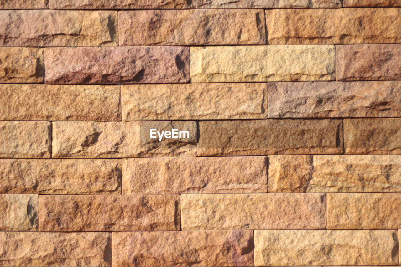 FULL FRAME SHOT OF STONE WALL