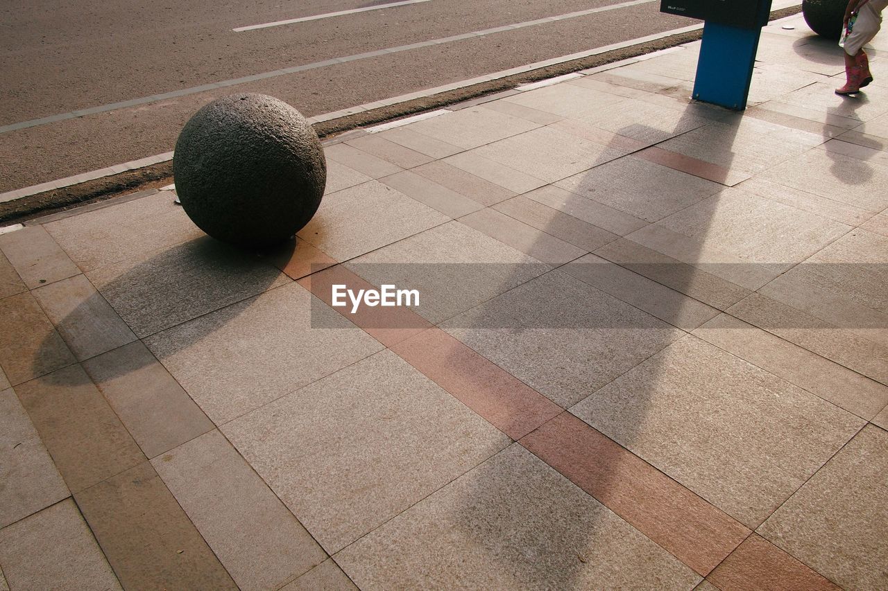 High angle view of sphere on sidewalk