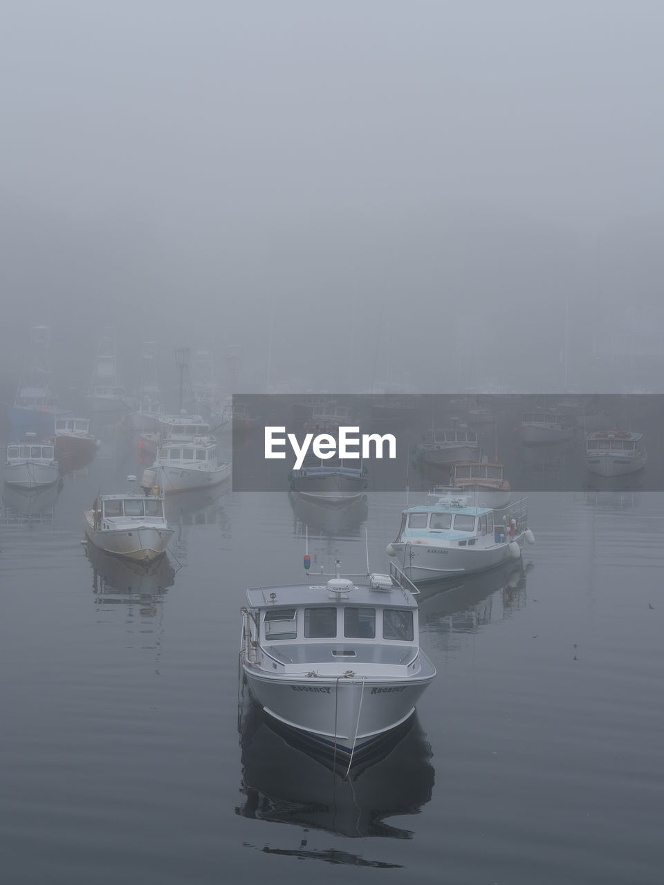 water, fog, nautical vessel, transportation, mode of transportation, ship, no people, nature, moored, sea, reflection, vehicle, waterfront, boat, harbor, sky, architecture, tranquility, watercraft, building exterior, day, outdoors, travel, beauty in nature, city, built structure, tranquil scene