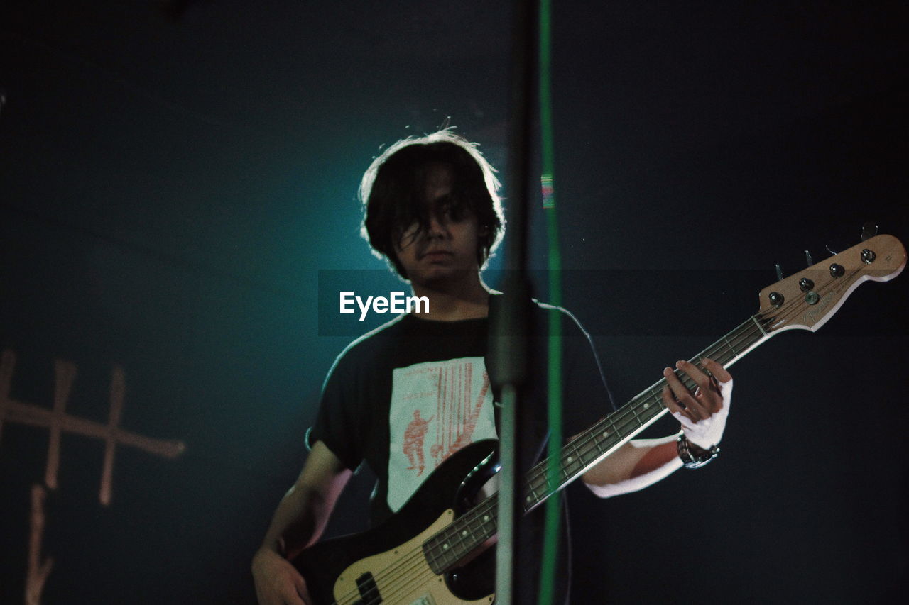 Man playing guitar on stage