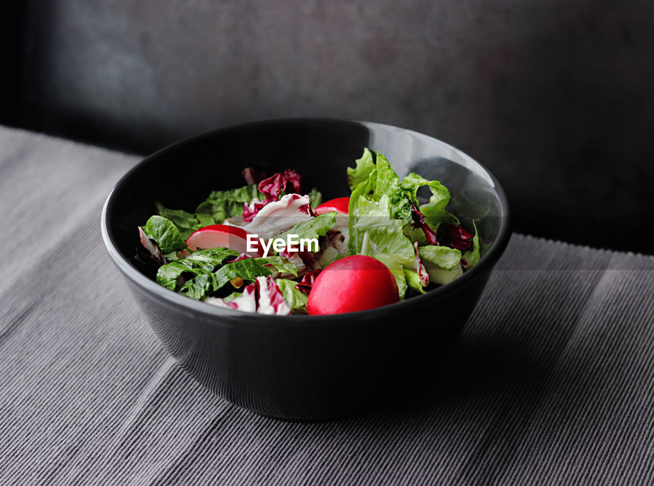 Close-up of salad in bowl on table