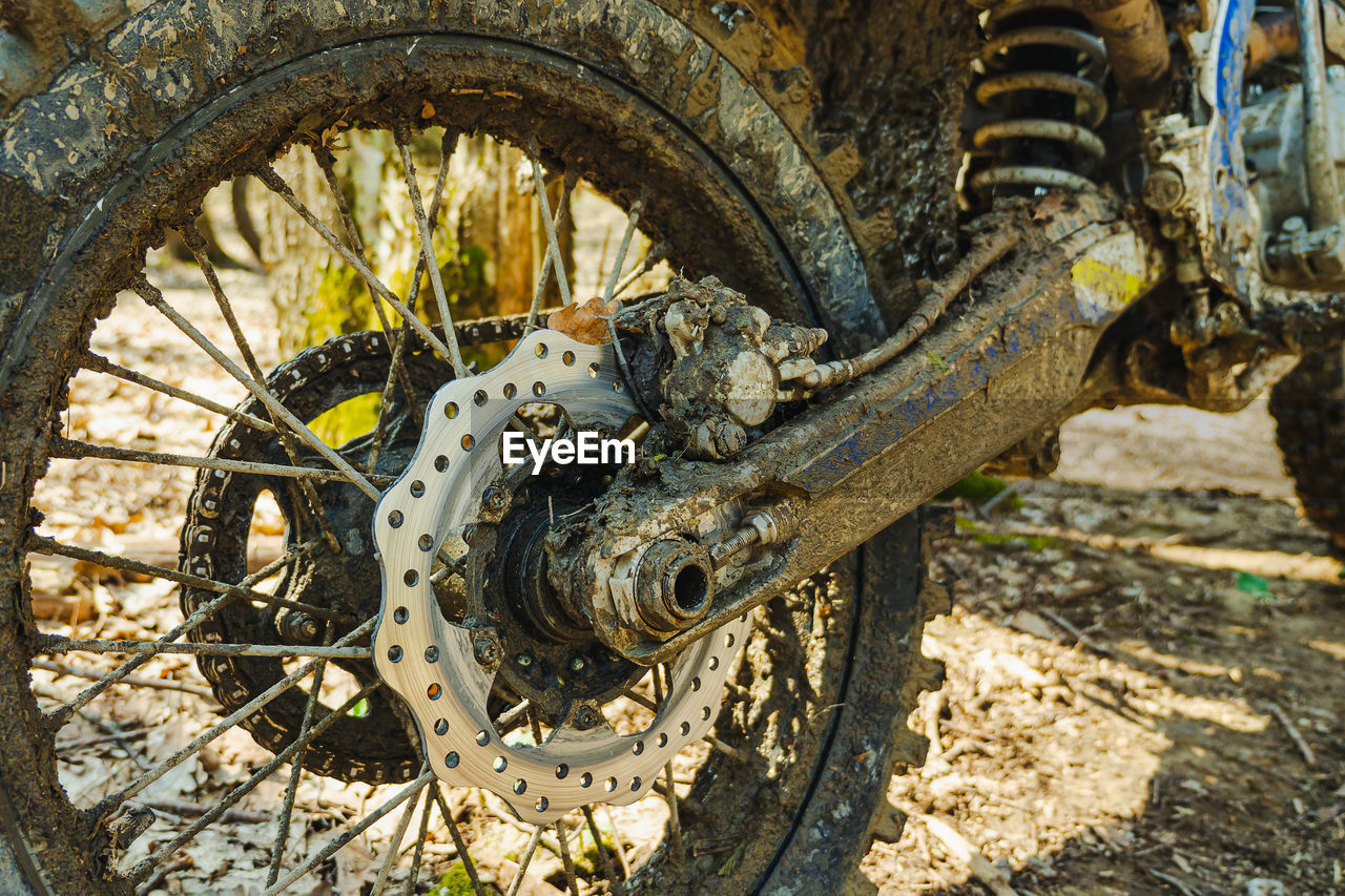 transportation, wheel, mode of transportation, bicycle, vehicle, metal, day, land vehicle, no people, tire, abandoned, old, rusty, mountain bike, nature, damaged, rundown, outdoors, sunlight, decline, deterioration, dirt, downhill mountain biking, close-up, weathered, auto part, bad condition, land