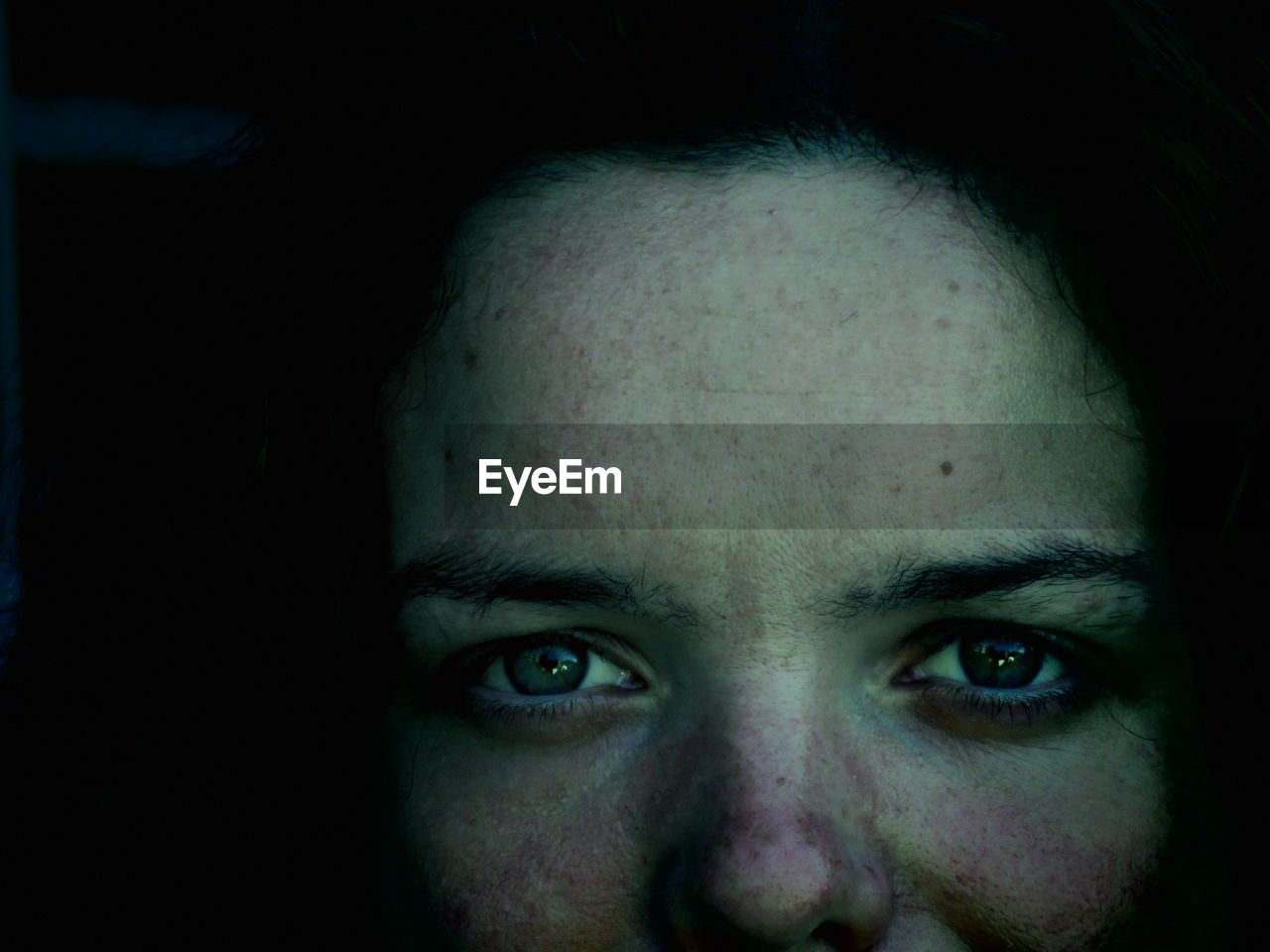 Close-up portrait of woman with freckle