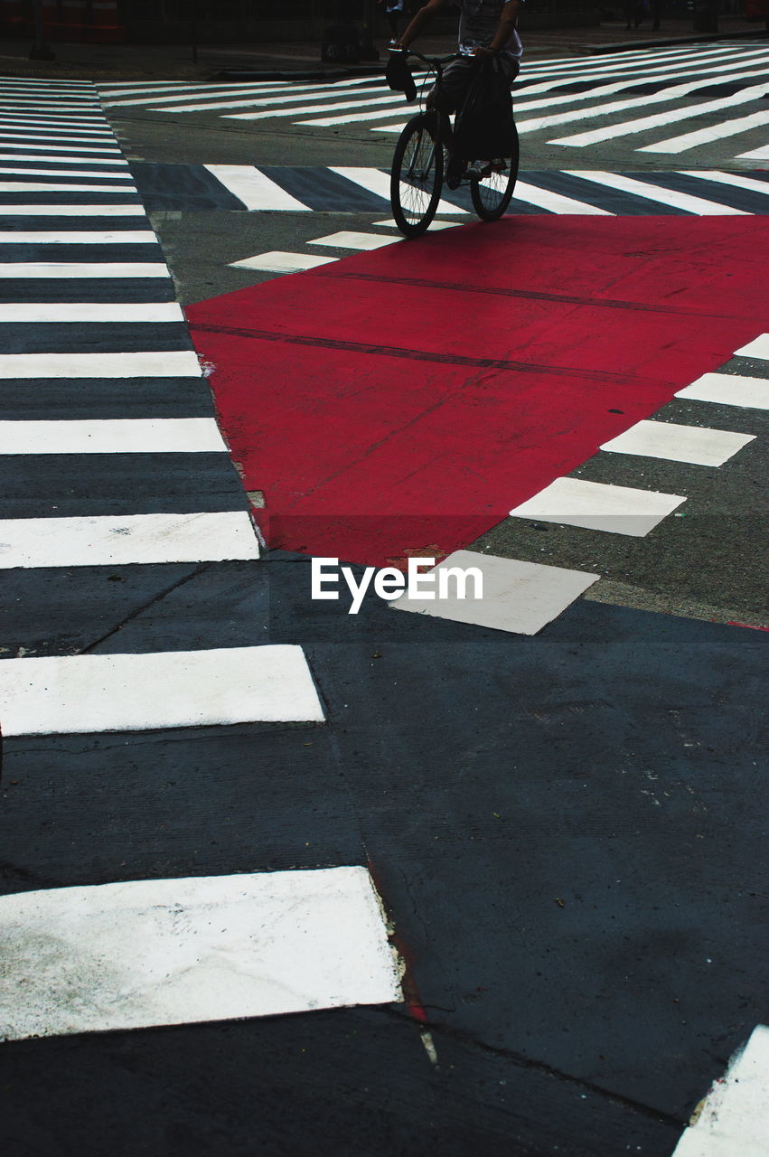 LOW SECTION OF PERSON CROSSING ROAD SIGN