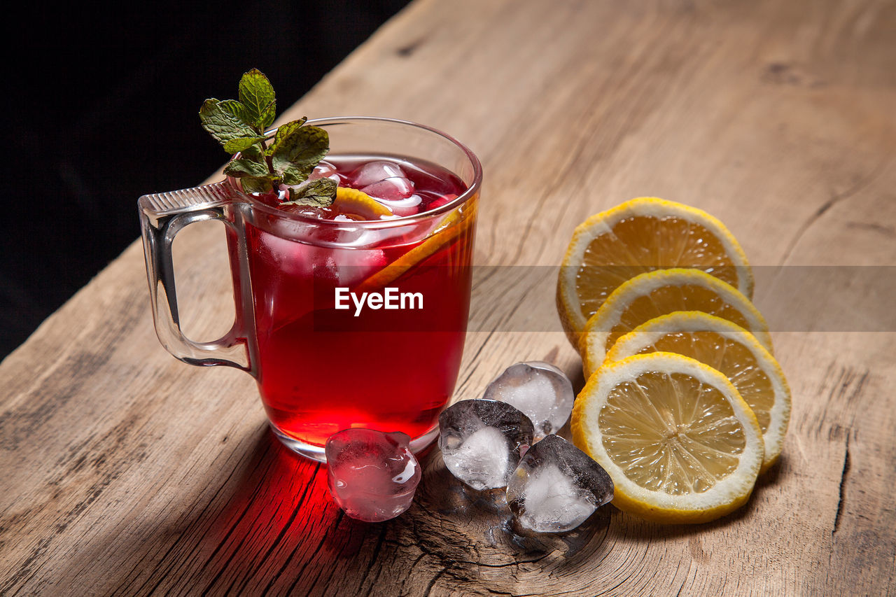 RED DRINK ON TABLE