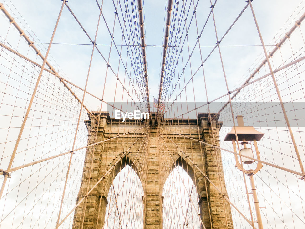 Low angle view of steel cables of brooklyn bridge against sky