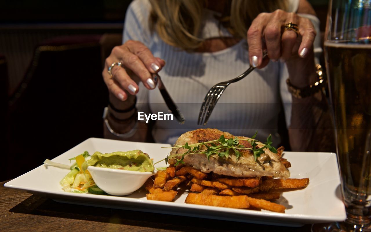 Midsection of woman at restaurant