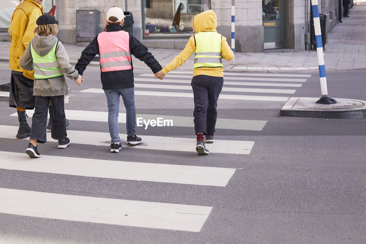 Children crossing road together