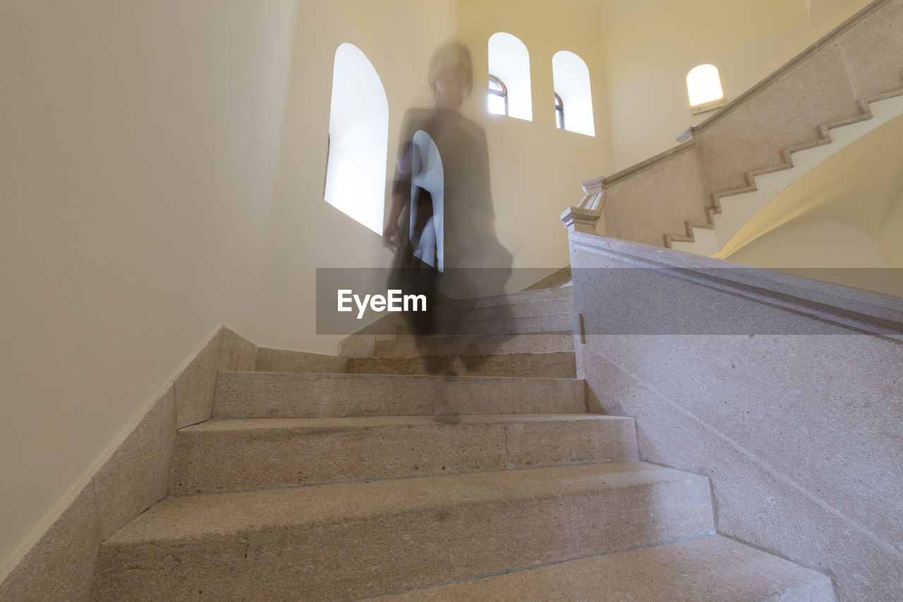 Low angle view of female ghost on steps