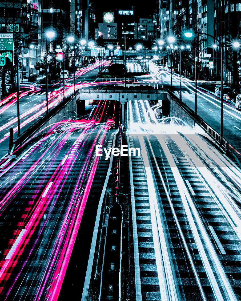 HIGH ANGLE VIEW OF LIGHT TRAILS ON ROAD