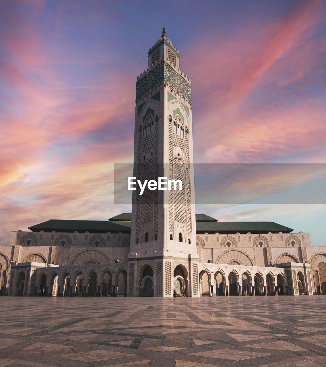 View of historical building of hassan ii mosque against sky during sunset - casablanca, morocco