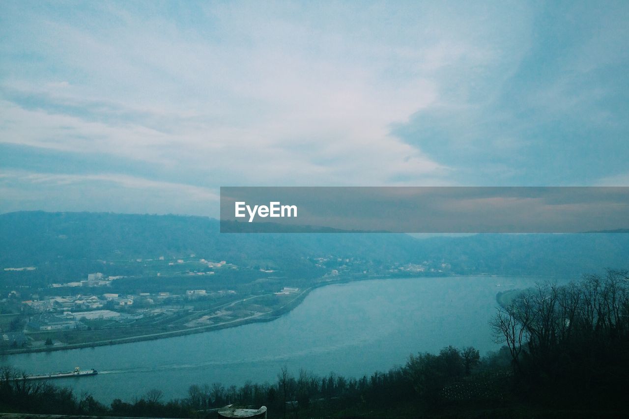 Scenic view of mountains against cloudy sky