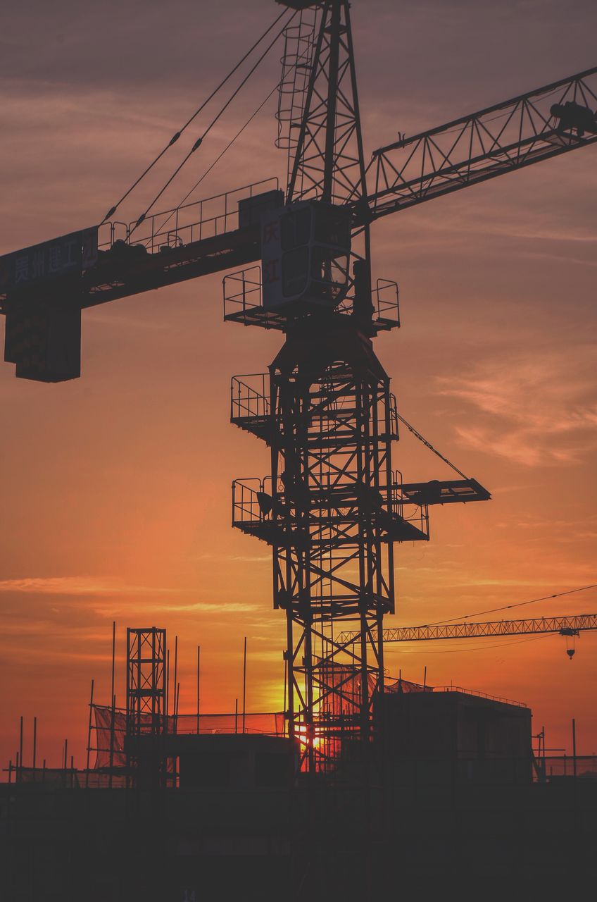 low angle view of crane at sunset