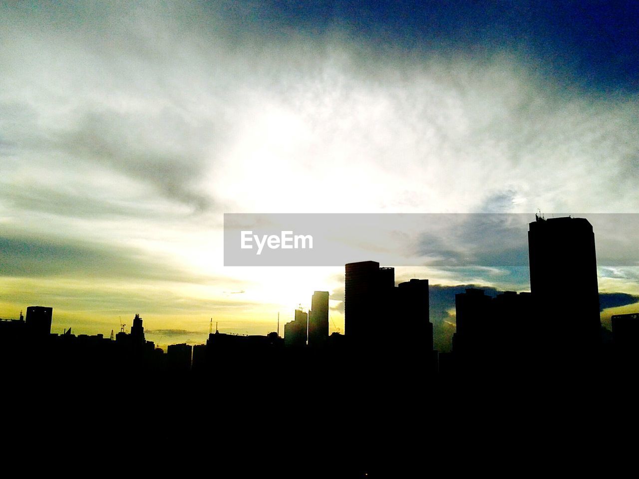 SILHOUETTE OF BUILDINGS AT SUNSET