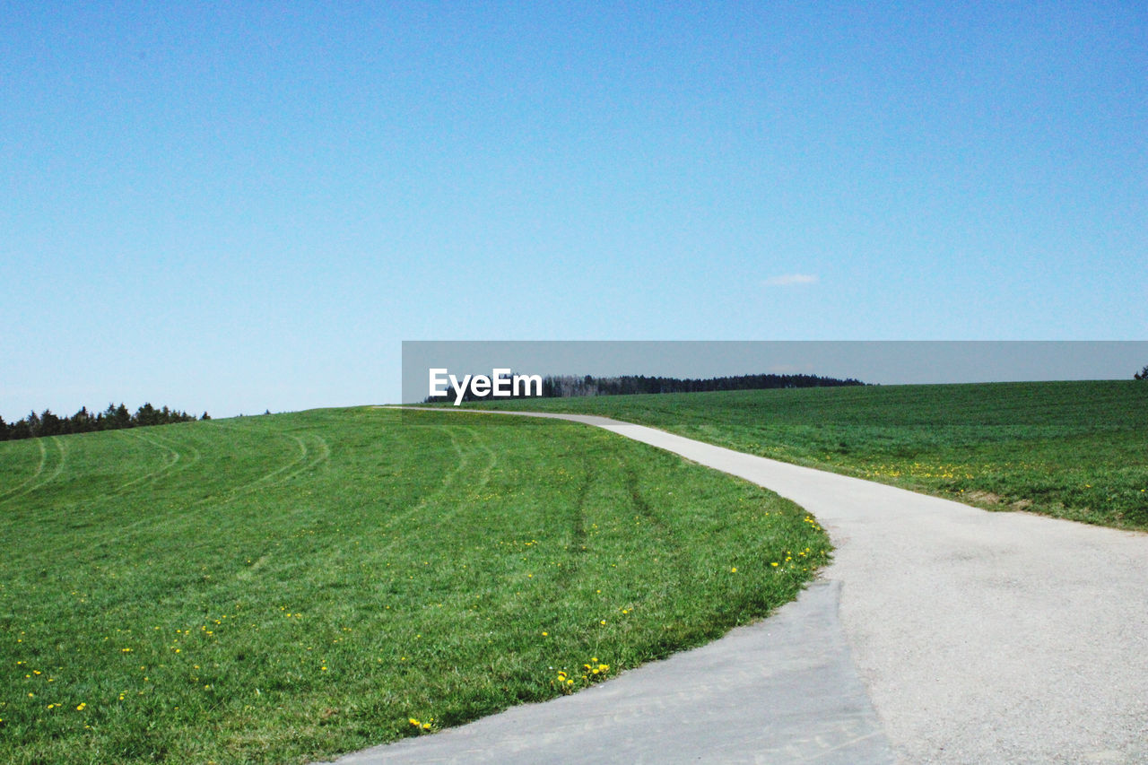 SCENIC VIEW OF LAND AGAINST CLEAR BLUE SKY