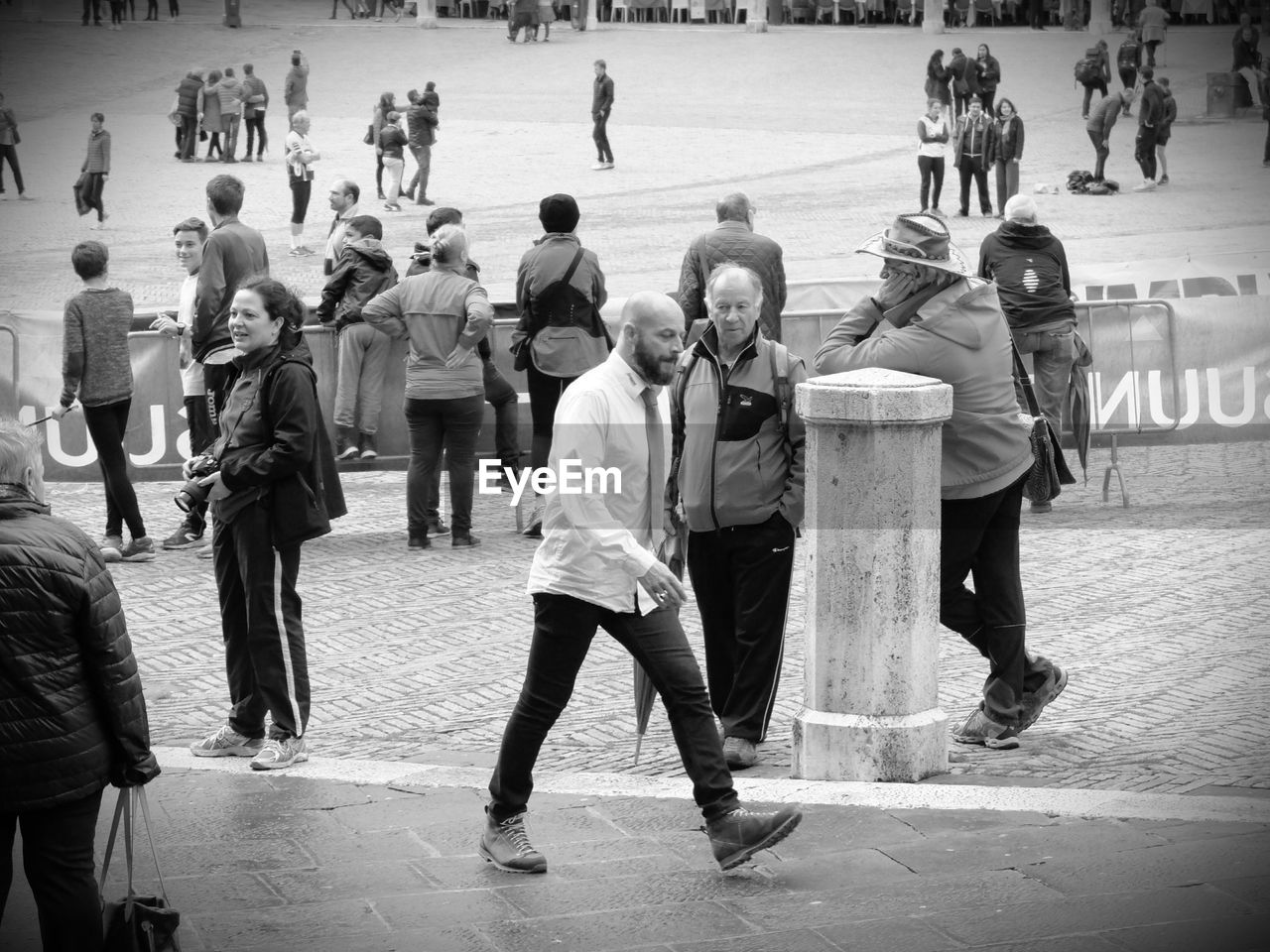 GROUP OF PEOPLE STANDING ON GROUND