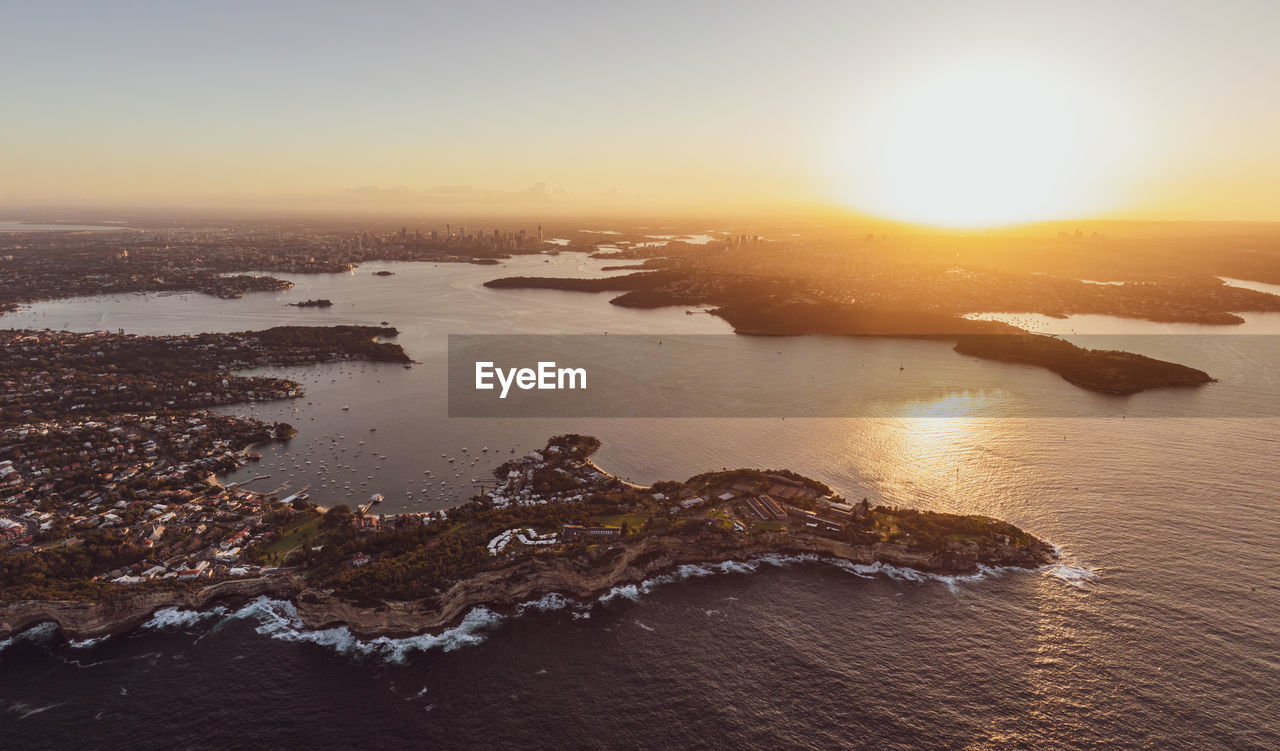 Drone view of south head, watsons bay with sydney harbour, cbd and harbour bridge in the background