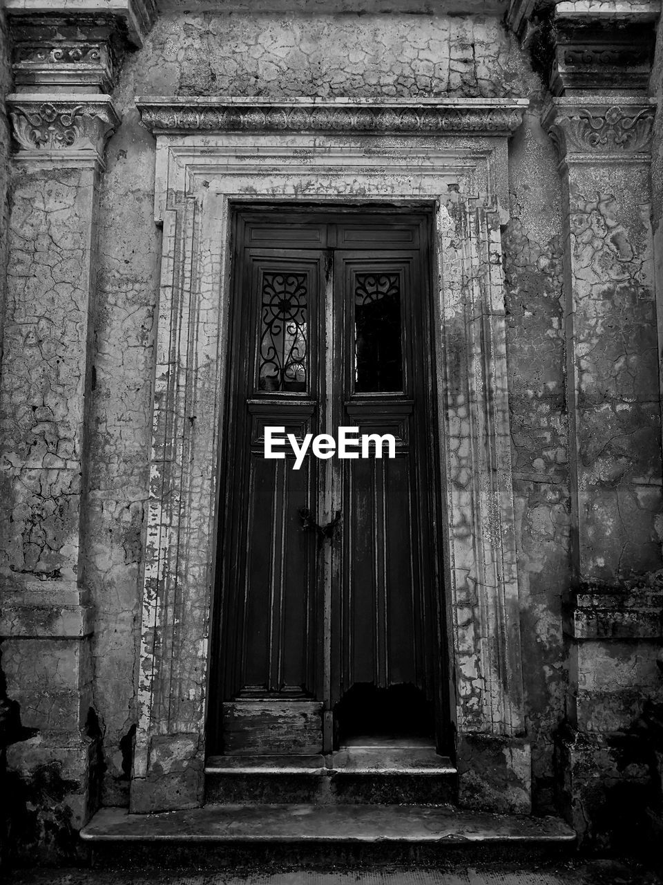 Closed door of old abandoned building