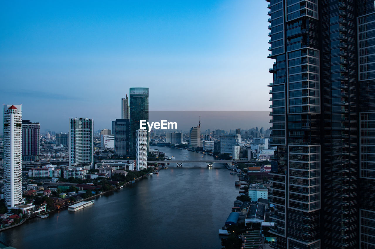 Modern buildings in city against sky