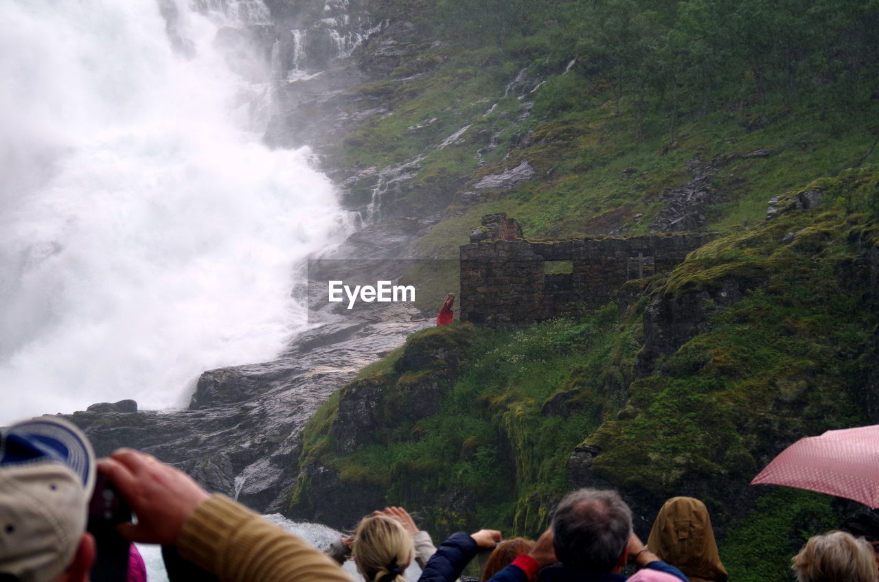 Crowd looking at waterfall
