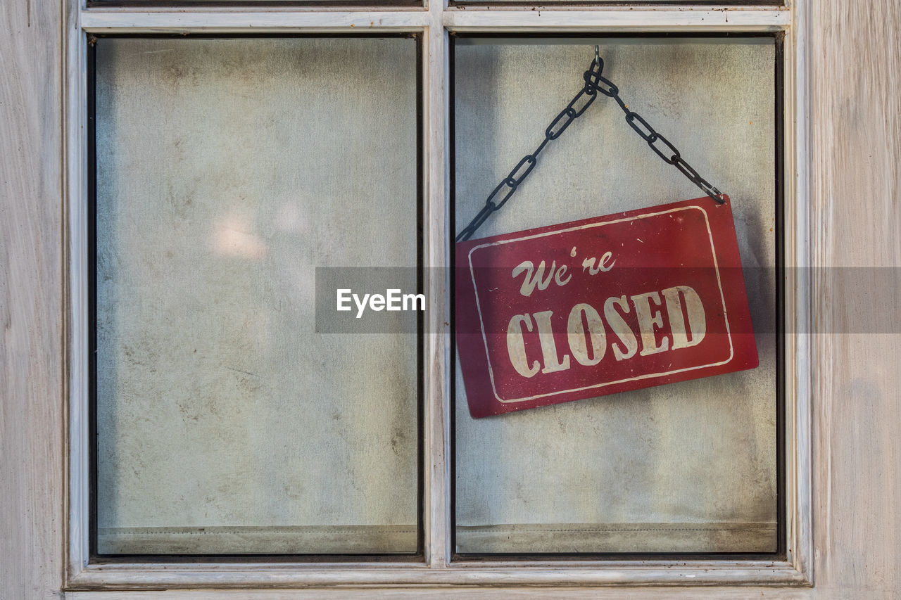 Closed sign hanging on window