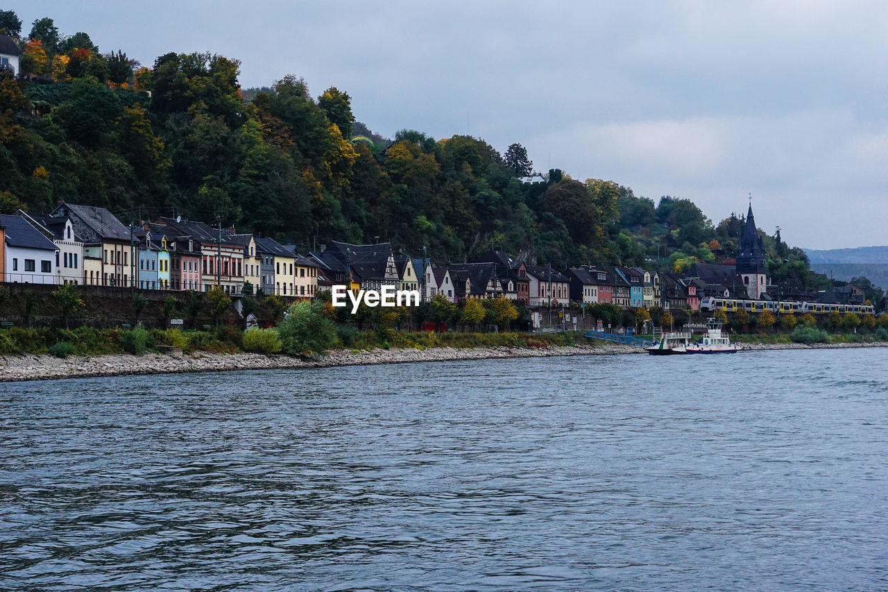 Town by river rhine against sky