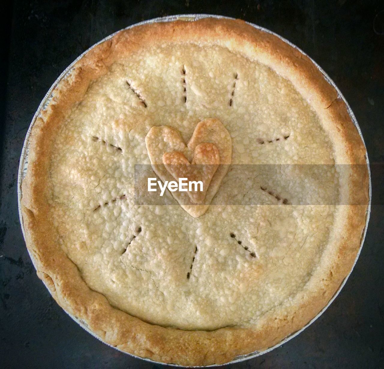 Directly above shot of baked blueberry pie on table