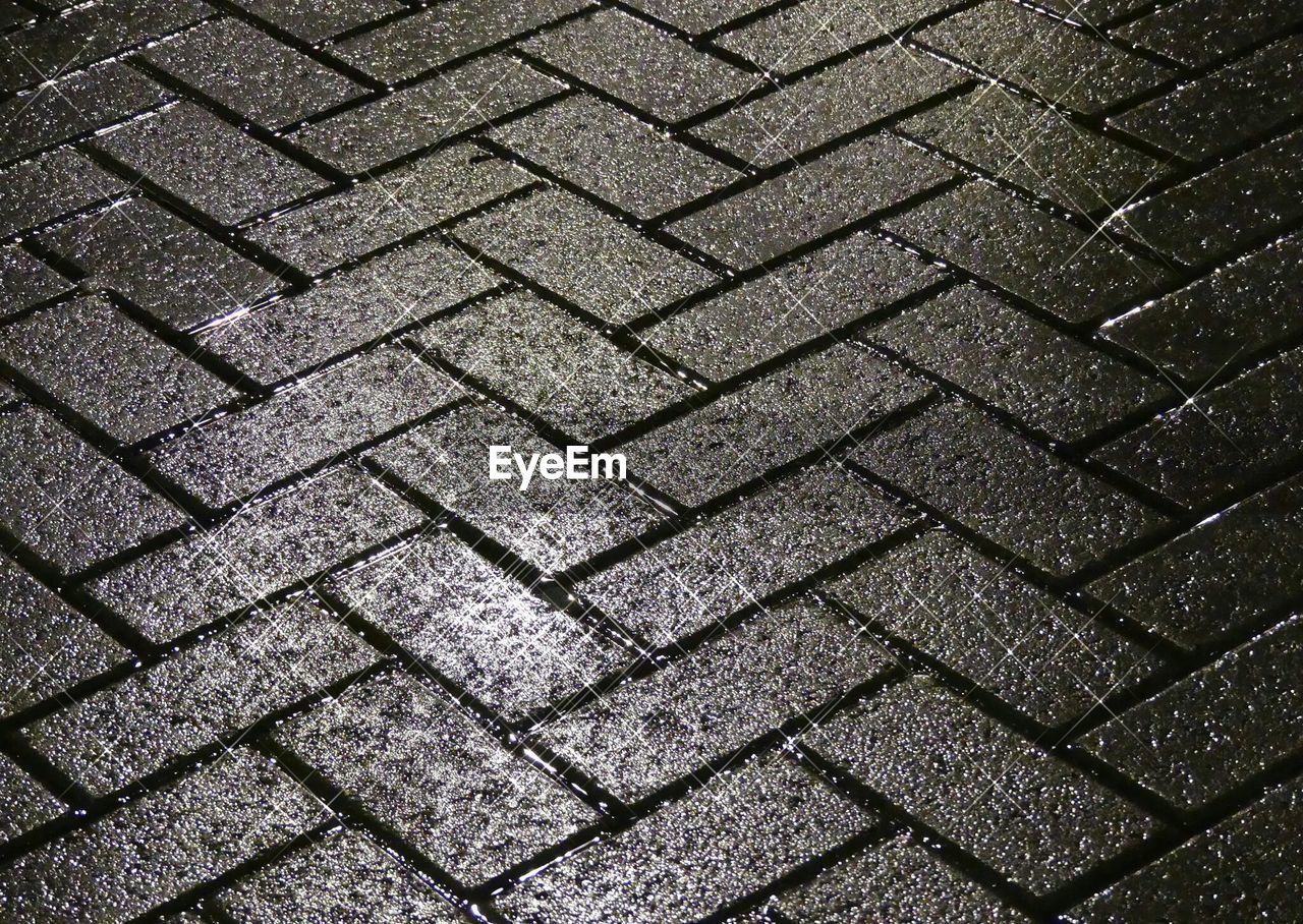 Full frame shot of wet street during night