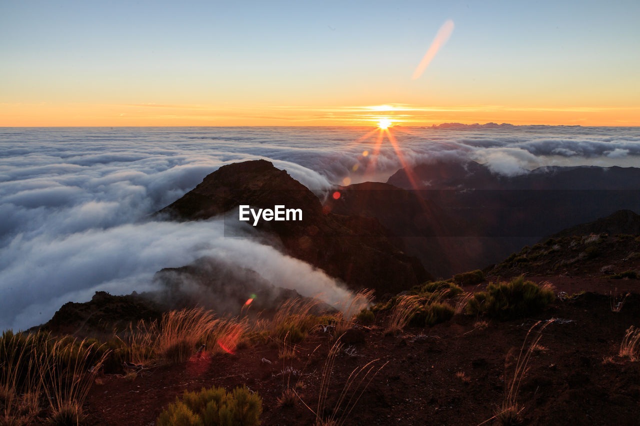 SCENIC VIEW OF SUNSET OVER LANDSCAPE