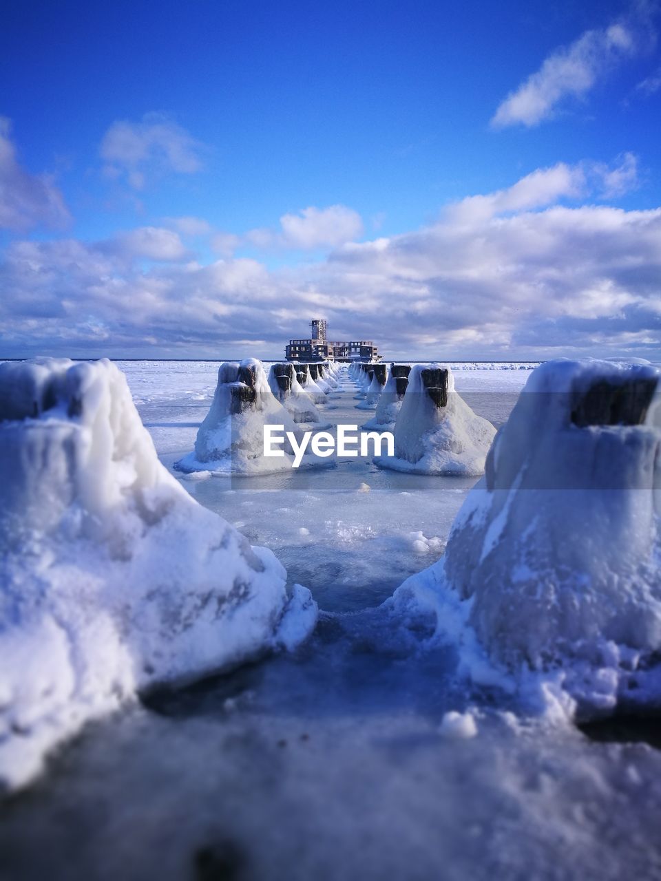 Scenic view of frozen lake against sky