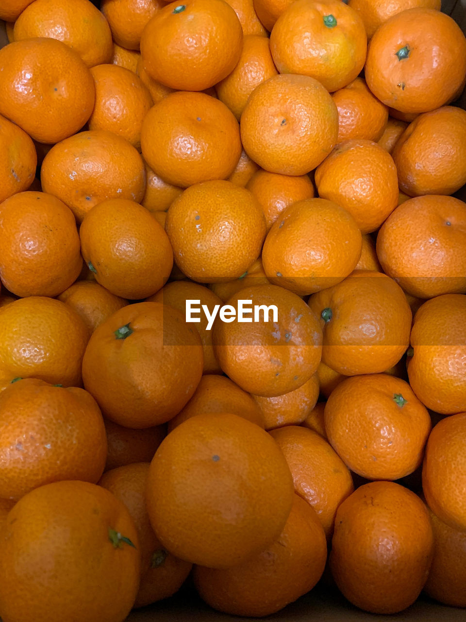 Full frame shot of oranges at market stall