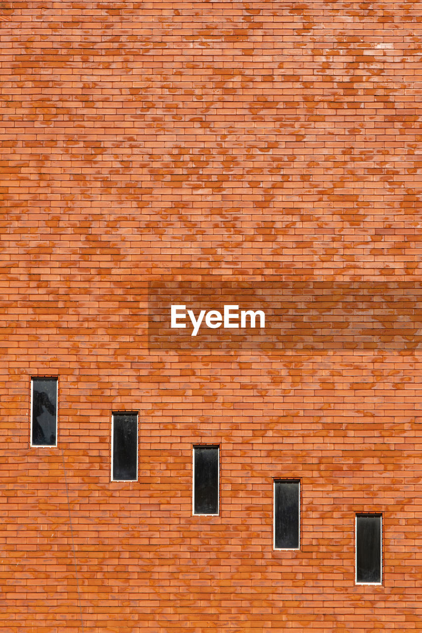 Windows on a brick wall