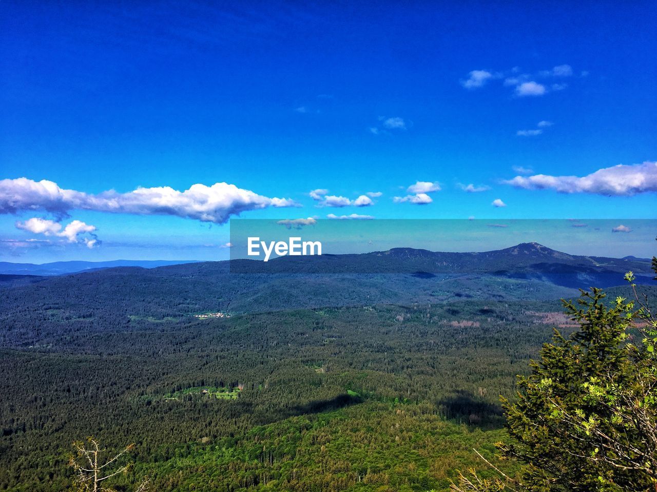 SCENIC VIEW OF LAND AGAINST BLUE SKY