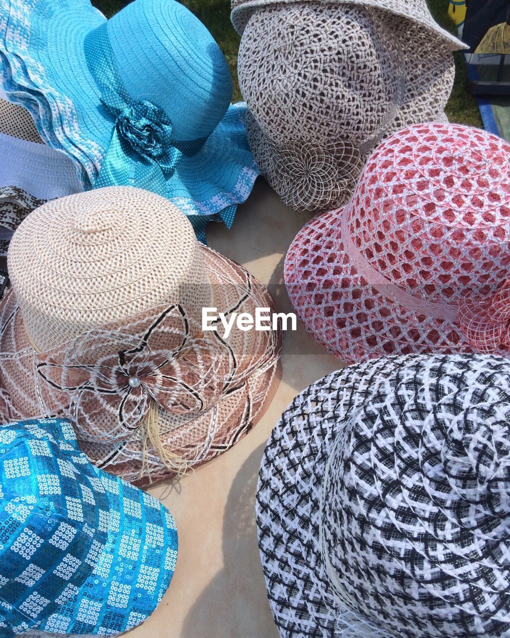 High angle view of sun hats for sale