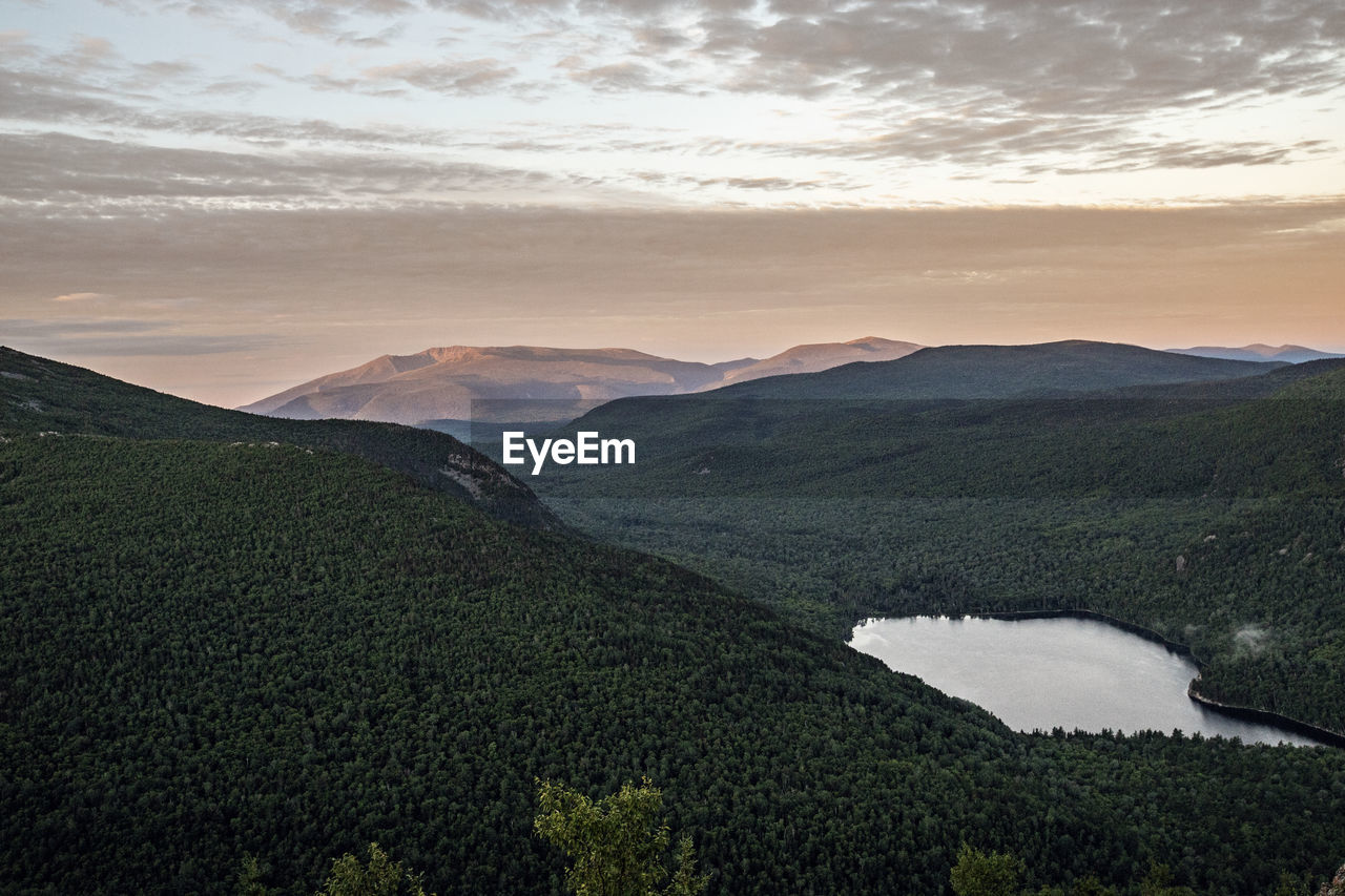 Sunrise over the forest and mountains of northern maine, baxter park.