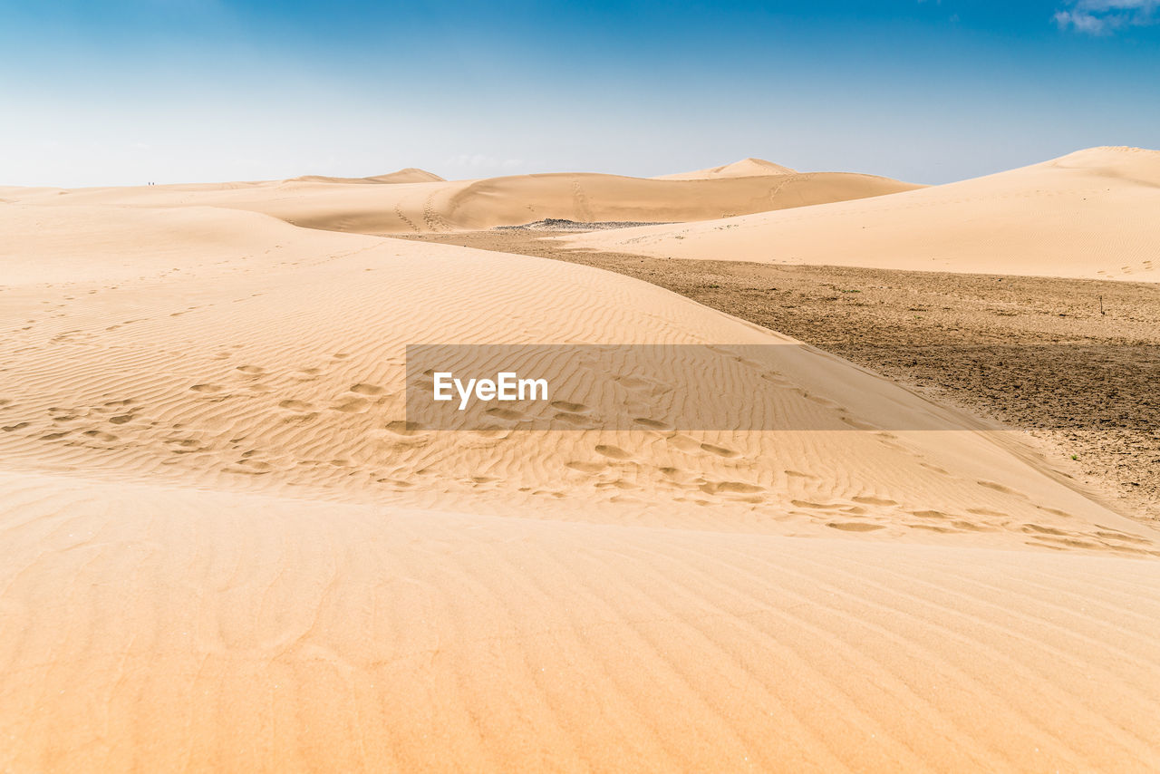 Scenic view of desert against clear sky