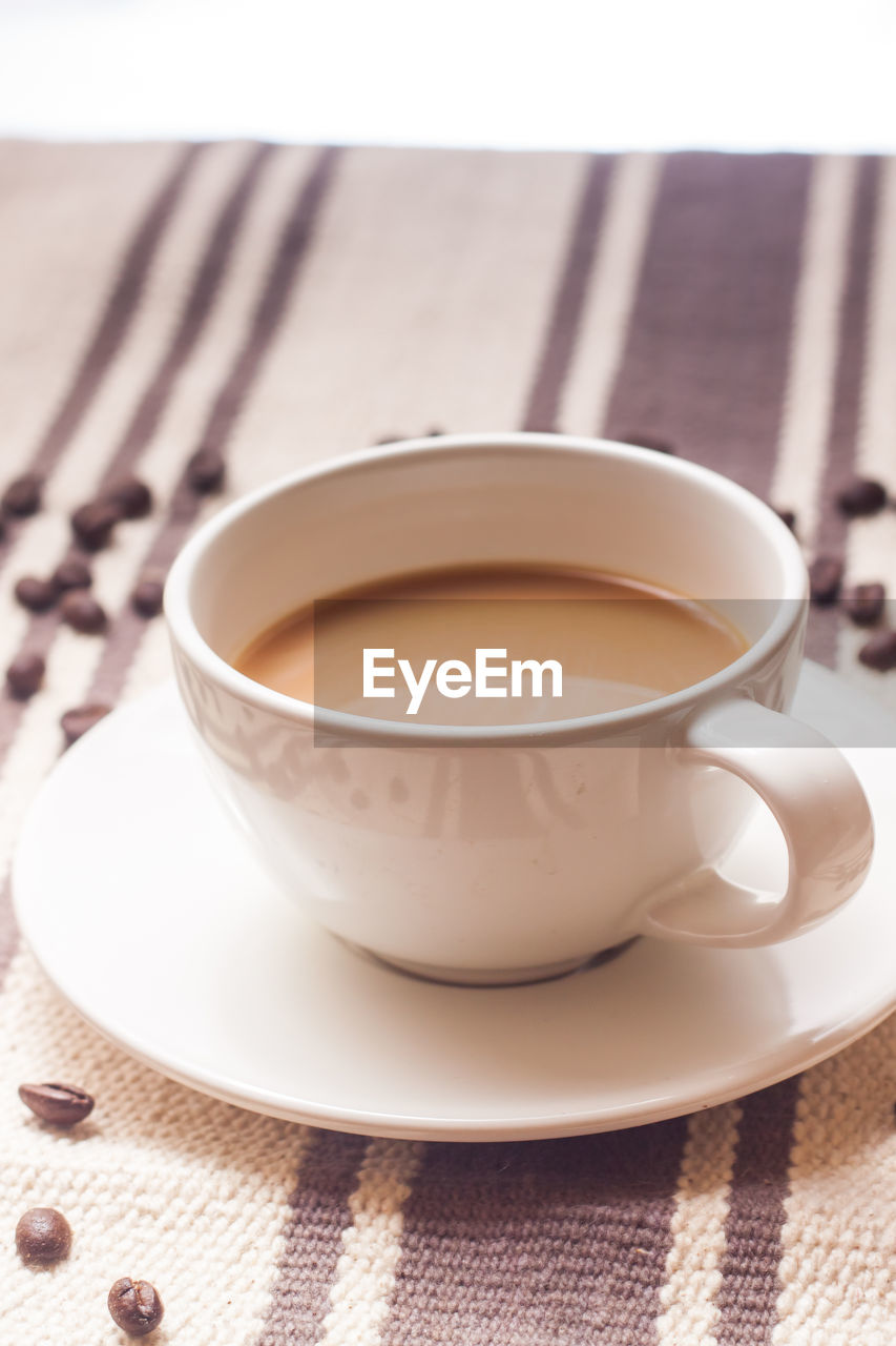 Close-up of coffee cup on table