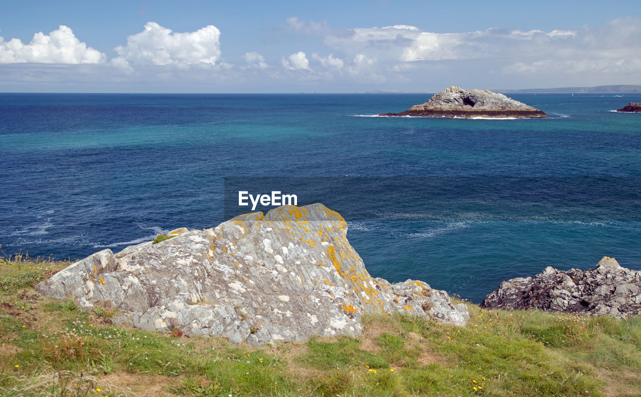 SCENIC VIEW OF SEA BY CLIFF